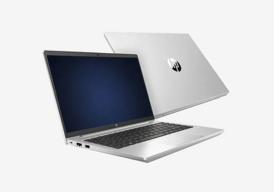 Two silver HP laptops, one open and one closed